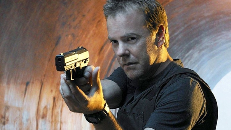 Jack Bauer holding a gun in the tunnel