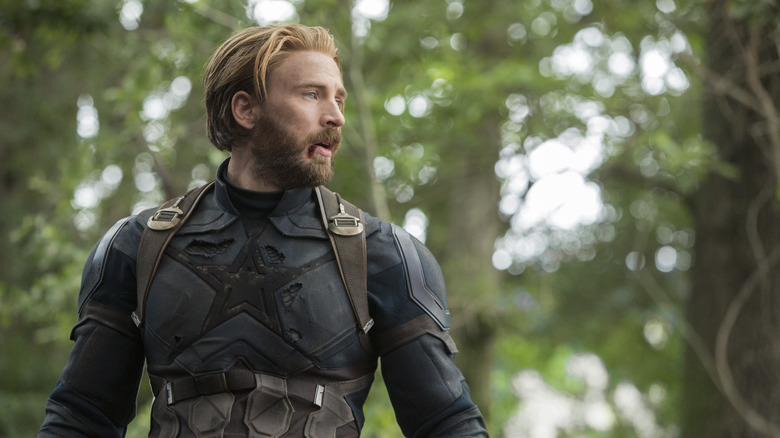 Captain America in a black costume, a star missing from his chest in Avengers: Infinity War