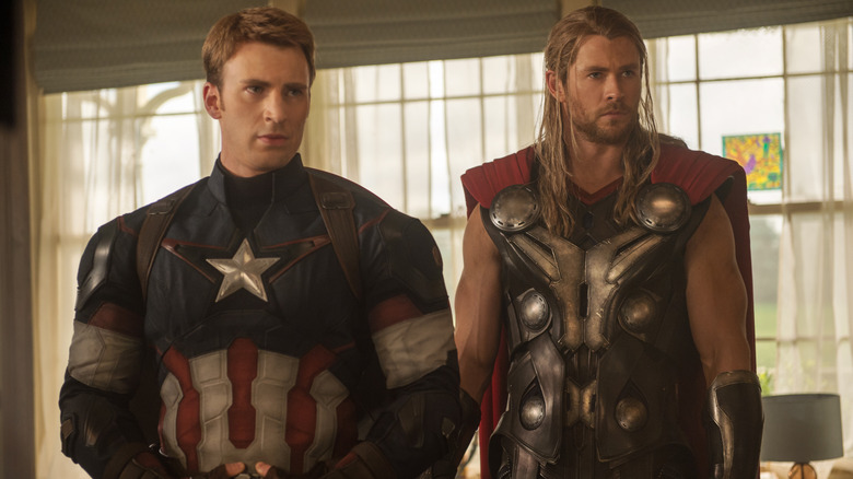 Captain America and Thor, looking stern, standing next to each other in Avengers: Age of Ultron