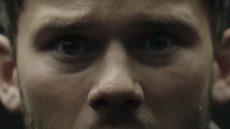 Jeremy Irvine as John Randolph Bentley is seen in extreme closeup in Treadstone