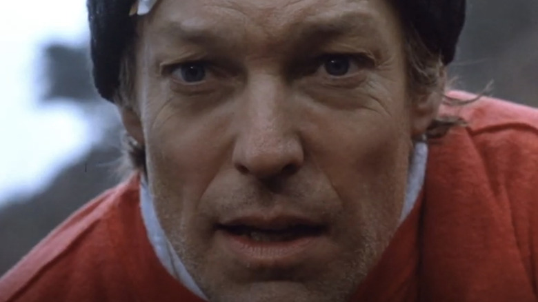 Richard Chamberlain as Jason Bourne is seen in closeup with a band-aid on his face in The Bourne Identity