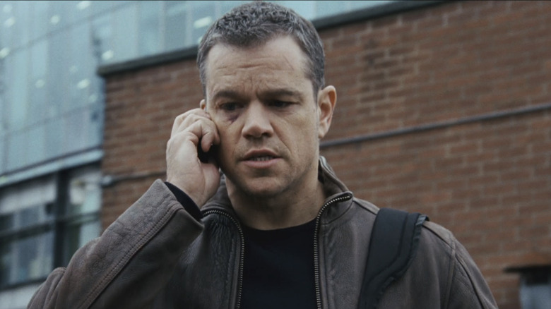 Matt Damon as Jason Bourne talks on a cellphone as he walks in Jason Bourne