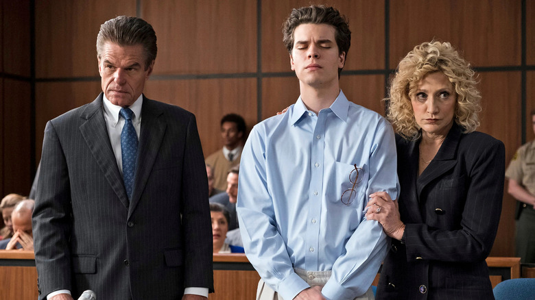 One of the Mendendez brothers flanked by his lawyers, including Leslie Abramson, as seen on Law & Order: True Crime: The Menendez Murders.