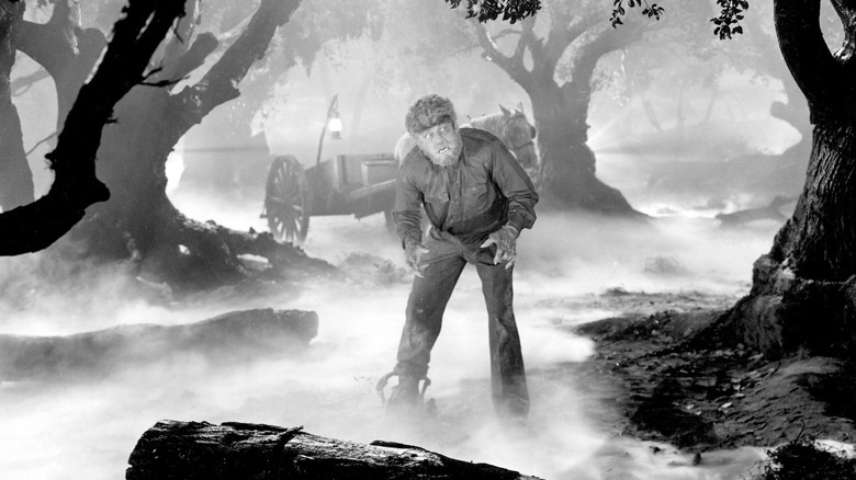 The Wolf Man (1941) standing in the foggy woods