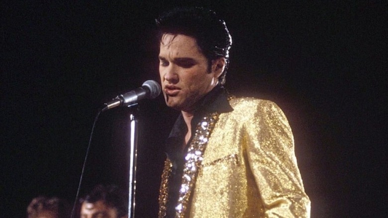 Kurt Russell wears gold and croons as Elvis Presley in Elvis