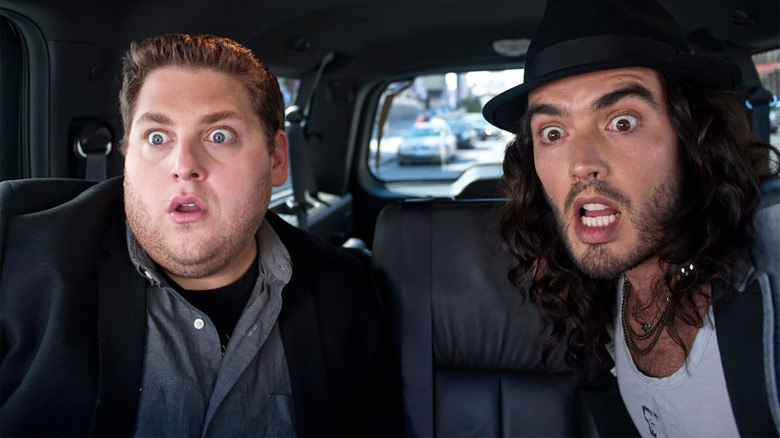 jonah hill and russell brand wide-eyed in a car in the movie get him to the greek