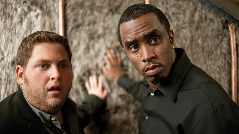 jonah hill and diddy touching a fur wall in the movie get him to the greek