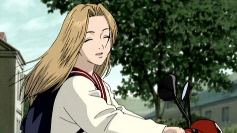 Monster Nina smiling and riding bike