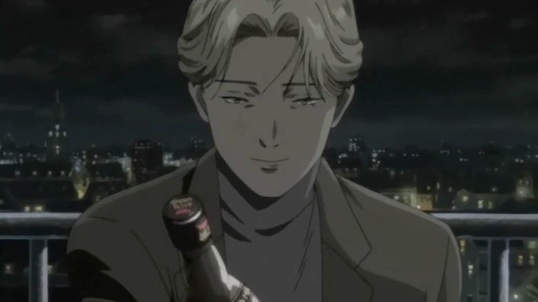 Monster Johan holding whiskey bottle