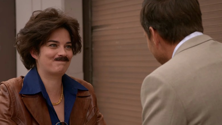 Annie Murphy smiling in mustache