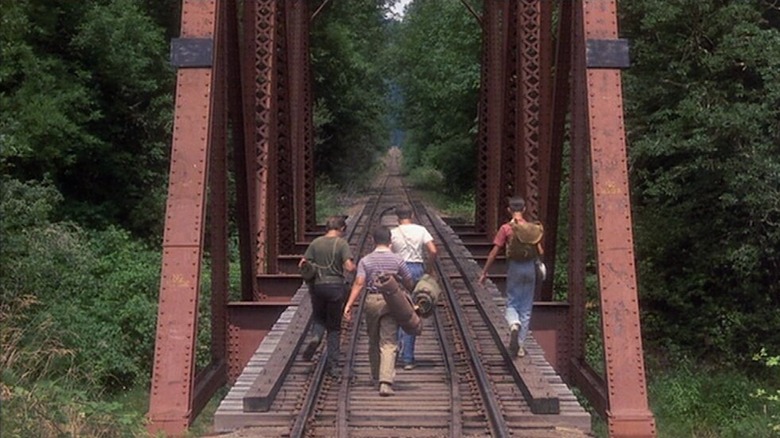 The Stand By Me kids walk the tracks