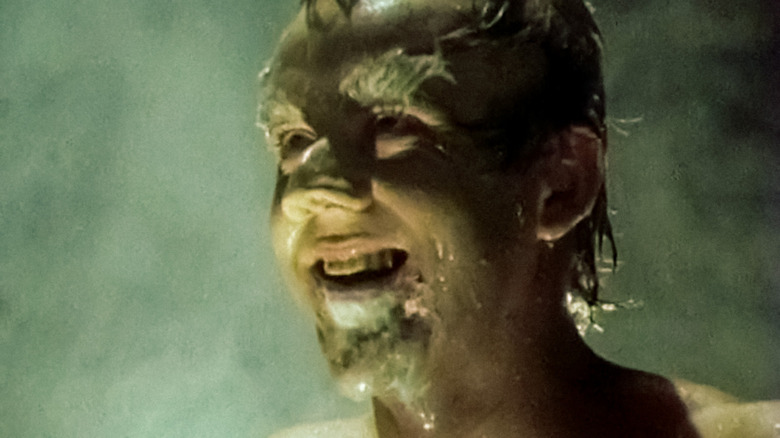 A Tilbury imp (Karl Ágúst Úlfsson) grins after vomiting green butter in Tilbury (1987)