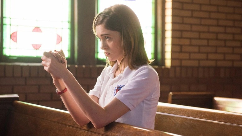 Alice praying in the church.