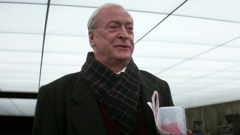 Michael Caine's Alfred Pennyworth in the makeshift Batcave in The Dark Knight
