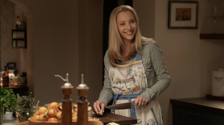 Lisa Kudrow's Lydia cuts mushrooms in the kitchen in the film 