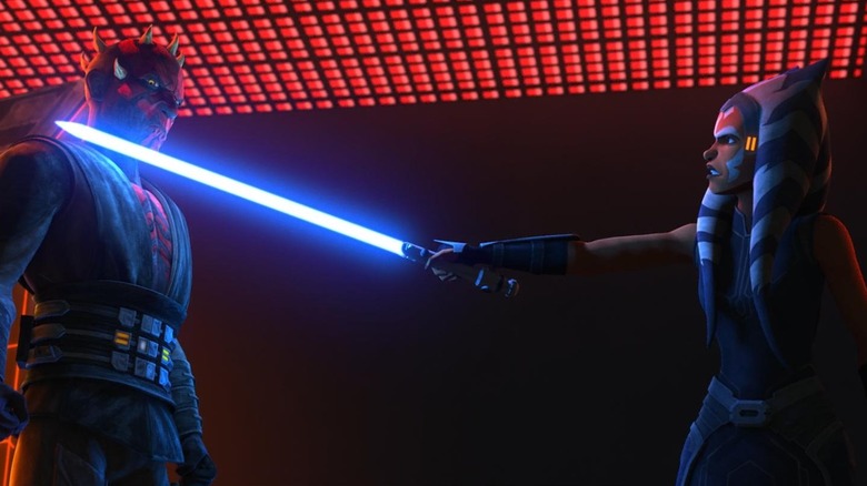 Ahsoka Tano with her lightsaber at Maul's throat in Star Wars: The Clone Wars