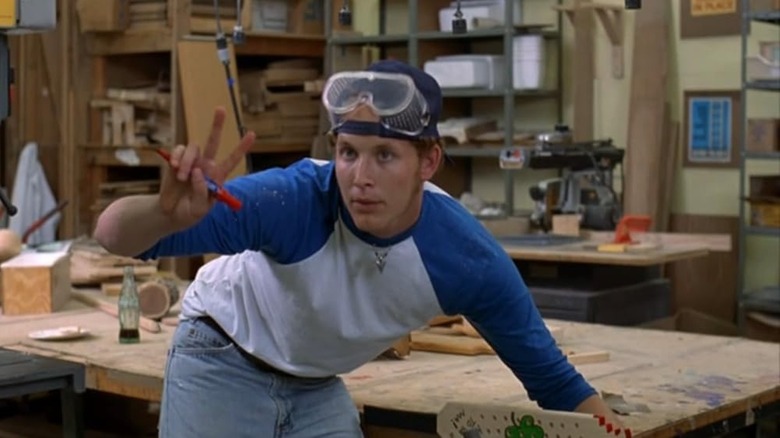 Cole Hauser puts the finishing touches on his hazing paddle in Dazed and Confused