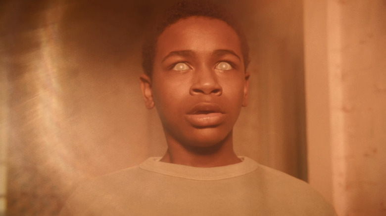 Blake Cameron James's Will Hanlon is seen in closeup with glazed over eyes in It Welcome to Derry