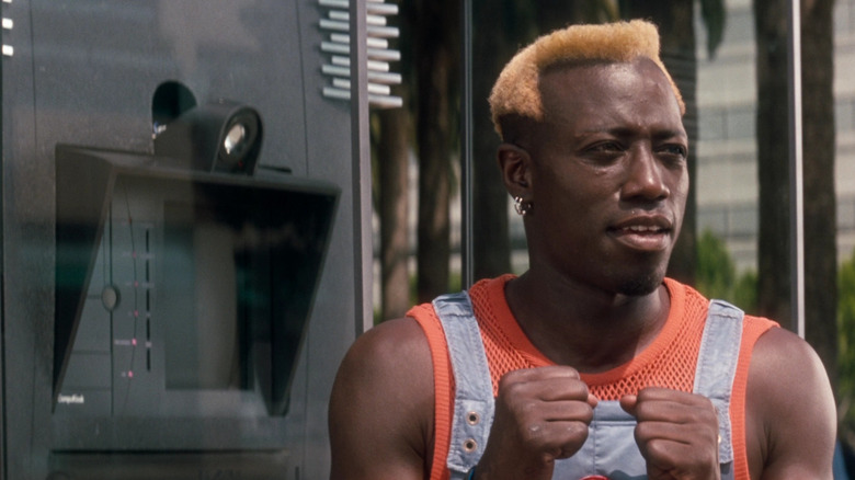 Simon Phoenix next to an ATM in Demolition Man