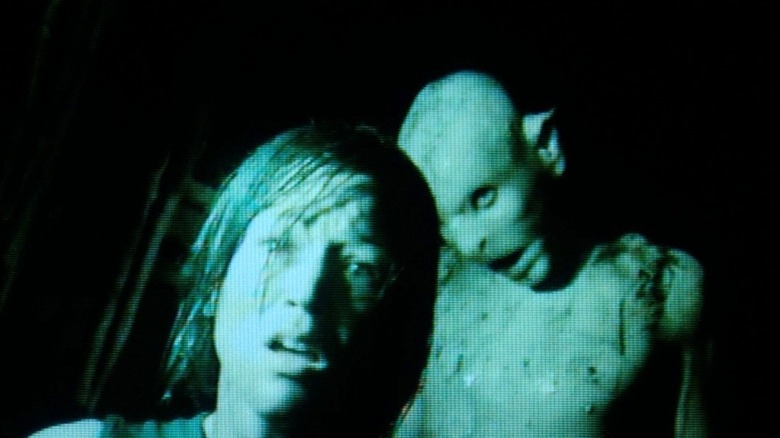 Crawler behind Beth in The Descent (2005)