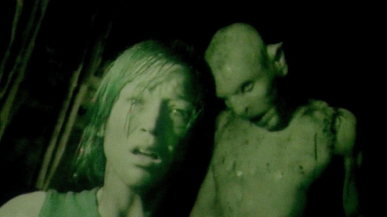 Juno being stalked by a monster in The Descent