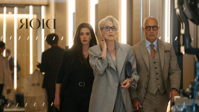 Andy, Miranda, and Nigel walking in the Dior offices in The Devil Wears Prada 2