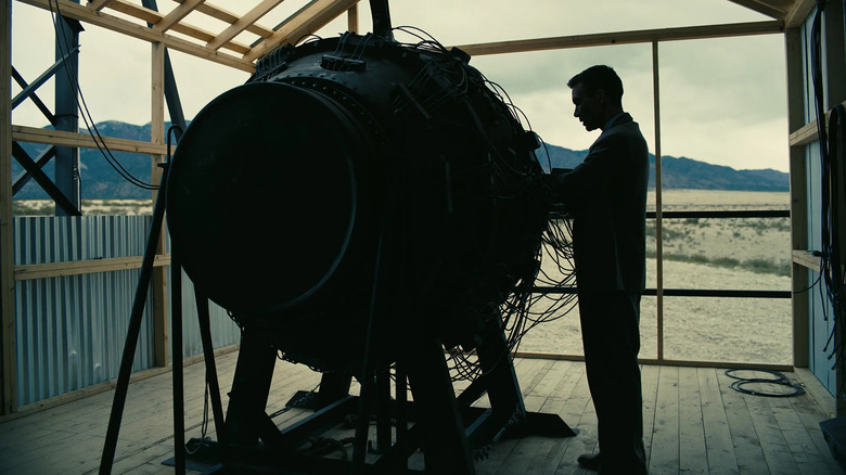 J. Robert Oppenheimer puts the finishing touches on his prototype atomic bomb at Los Alamos in "Oppenheimer"