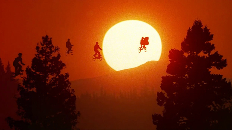 E.T. and friends fly above the trees on their bikes