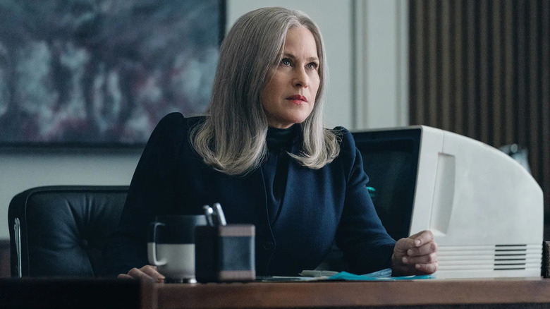 Patricia Arkite as a Cople lady sitting on her office at the end of severity