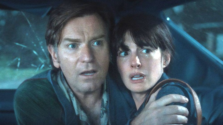 Greg and Denise Platt cowering in a car afraid in The End of Oak Street
