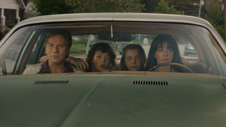 The Platt family staring out of the windshielld of the car in The End of Oak Street