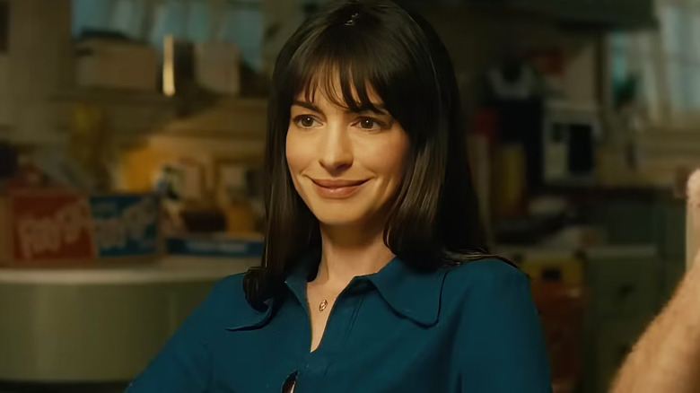 Denise smiles at the dinner table in The End of Oak Street
