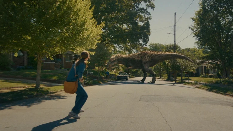 Anne Hathaway as Denise Platt running away from an Allosaur in The End of Oak Street