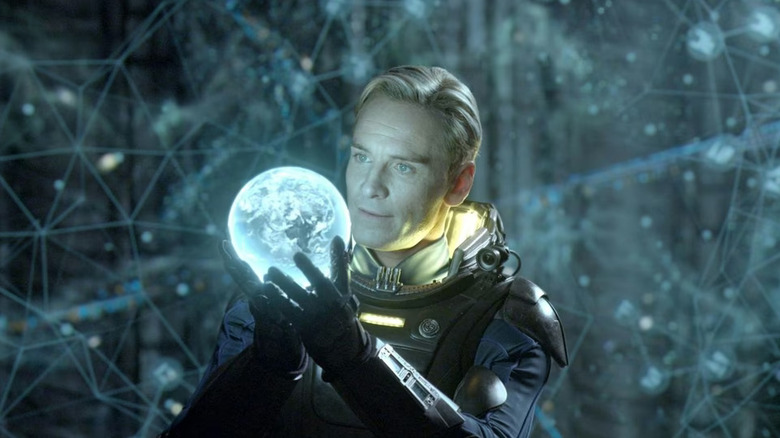 Michael Fassbender as David stares at a hologram of Earth in Prometheus