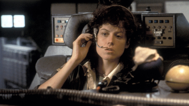 Sigourney Weaver as Ellen Ripley talks on a headset in Alien