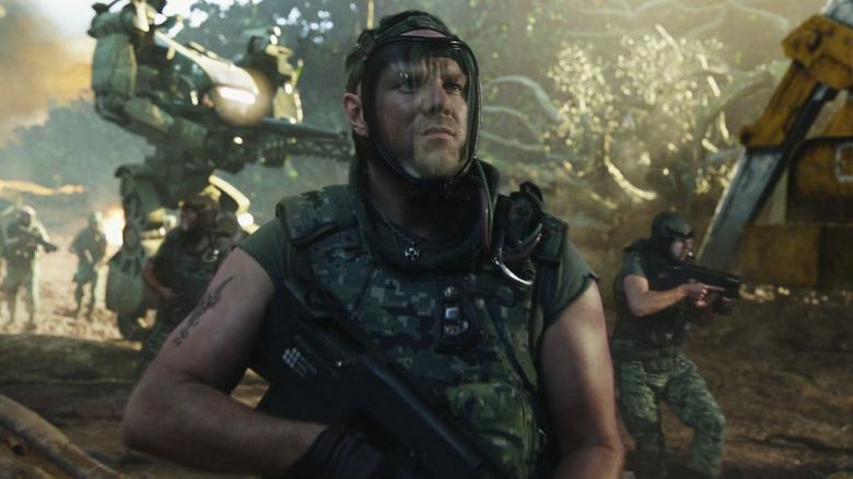 An RDA soldier walks with his unit in Avatar