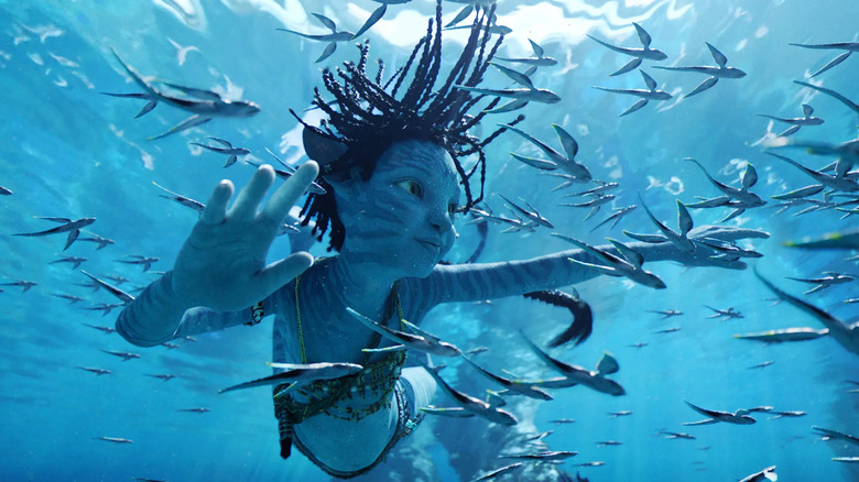 Trinity Bliss as Tuk swims in the ocean in Avatar: The Way of Water