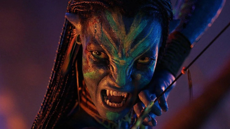 Zoe Saldana as Neytiri readies her bow in Avatar: Fire and Ash