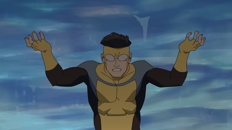 Mark lifts an iceberg above his head in Invincible