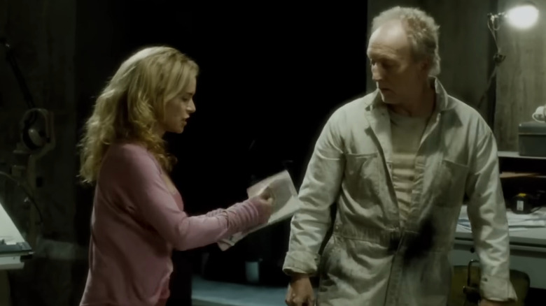 Betsy Russell and Tobin Bell as Jill and John arguing in Saw 4