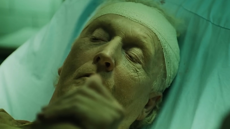 Tobin Bell as John Kramer in a hospital bed in Saw 3