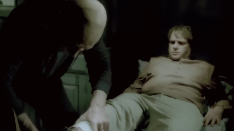 Tobin Bell and Cary Elwes as John Kramer and Dr Gordon in a flashback in Saw 7