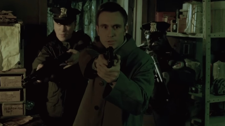 Chad Donella as Matt Gibson with two officers in Saw 7