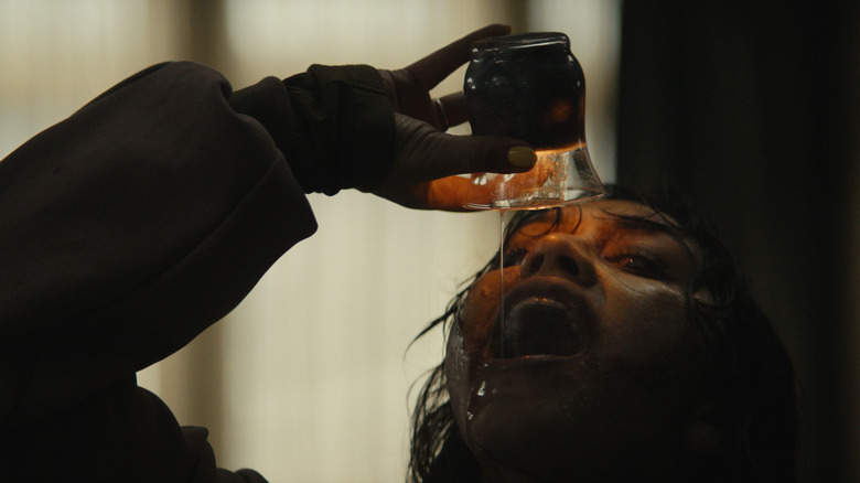 Someone drinks candle wax in Evil Dead Burn