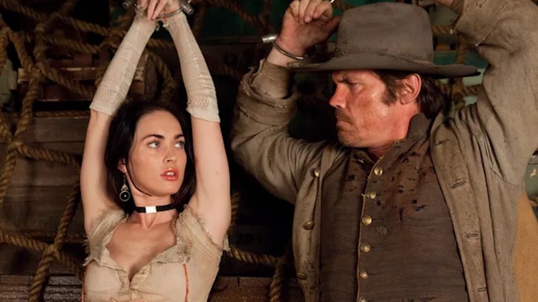 Josh Brolin as Jonah Hex and Megan Fox as Lilah Fox are chained up in Jonah Hex