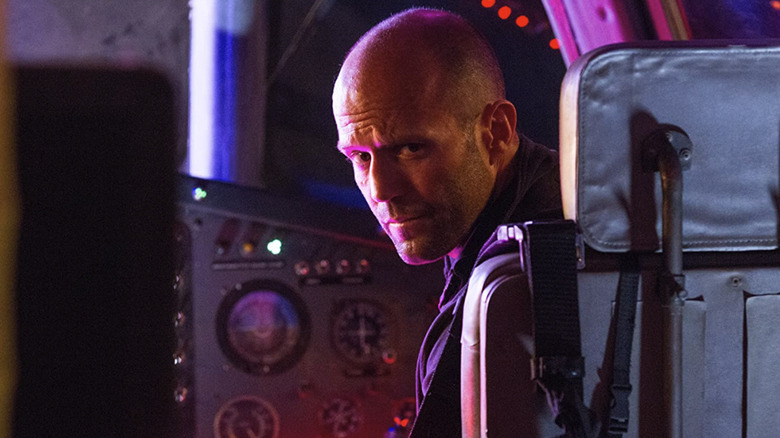 Jason Statham in a cockpit in The Expendables 3
