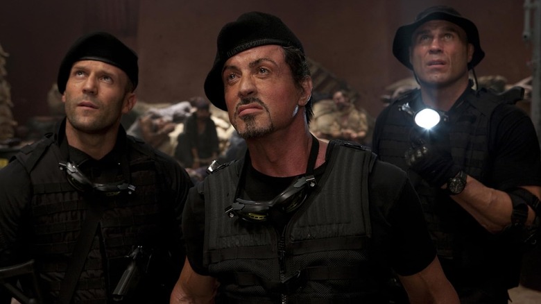 Lee Christmas, Barney Ross, and Toll Road standing together in The Expendables