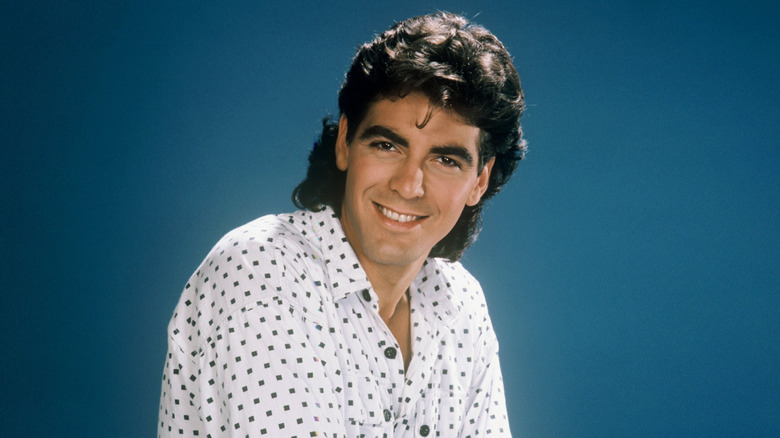 George Clooney as George Burnett, smiling on "The Facts of Life"