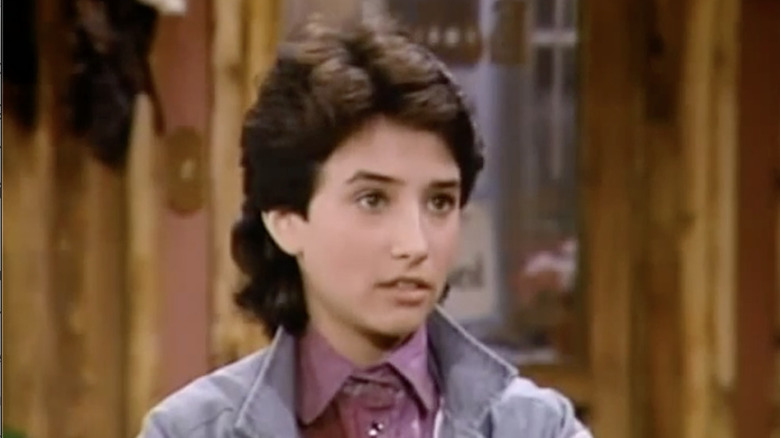 Pamela Adlon as Kelly Affinado, scowling on "The Facts of Life"