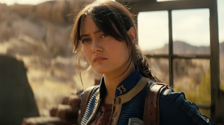 Lucy squinting at the Ghoul offscreen in the Fallout season 2 trailer